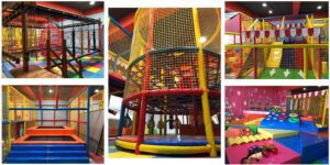 A collection of indoor play equipment, including slides, climbing structures, and ball pits.